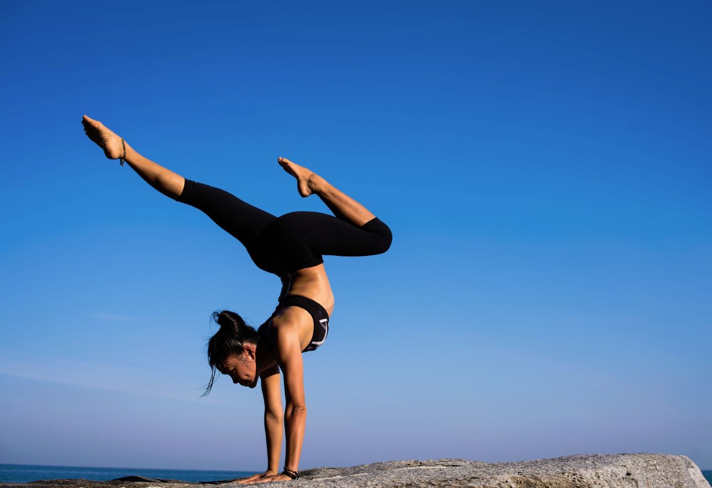 8 Yoga Poses You Can Do From Your Bed to Soothe Menopause Symptoms