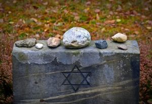 Holocaust victims buried after remains given to museum