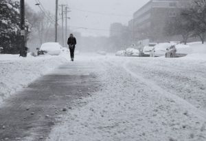 Spring storm keeps central US in icy grip, hampering travel