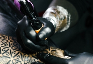 Tattoo artist sees bump in desire to erase hateful skin art